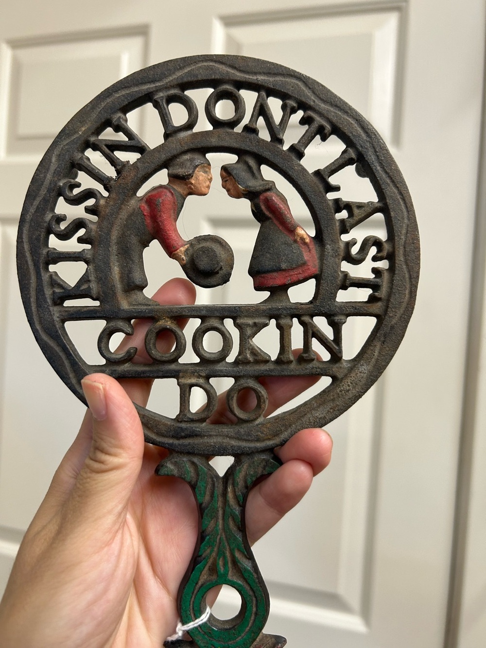 Vintage Cast Iron 'Kissin' Don't Last Cookin' Do' Trivet - Rustic Brown and Gree